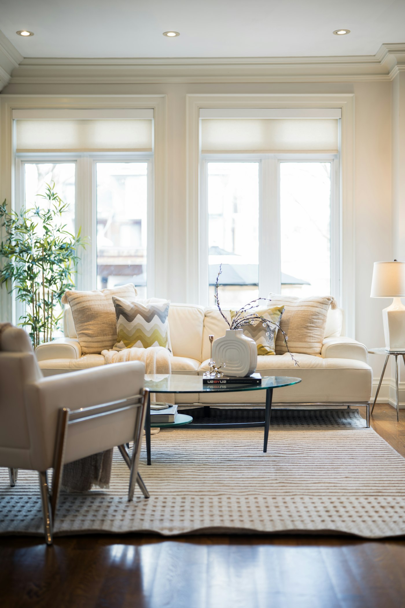 A bright, elegant living room with tall windows