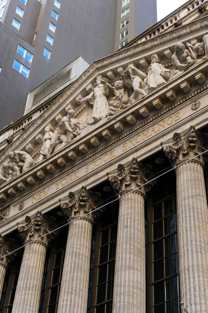 The New York Stock Exchange columns with a large US flag