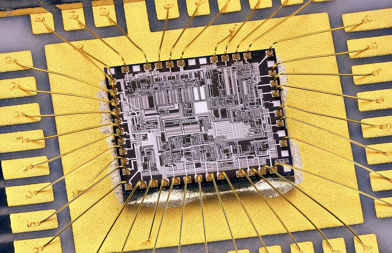 A microchip die wired to its gold frame