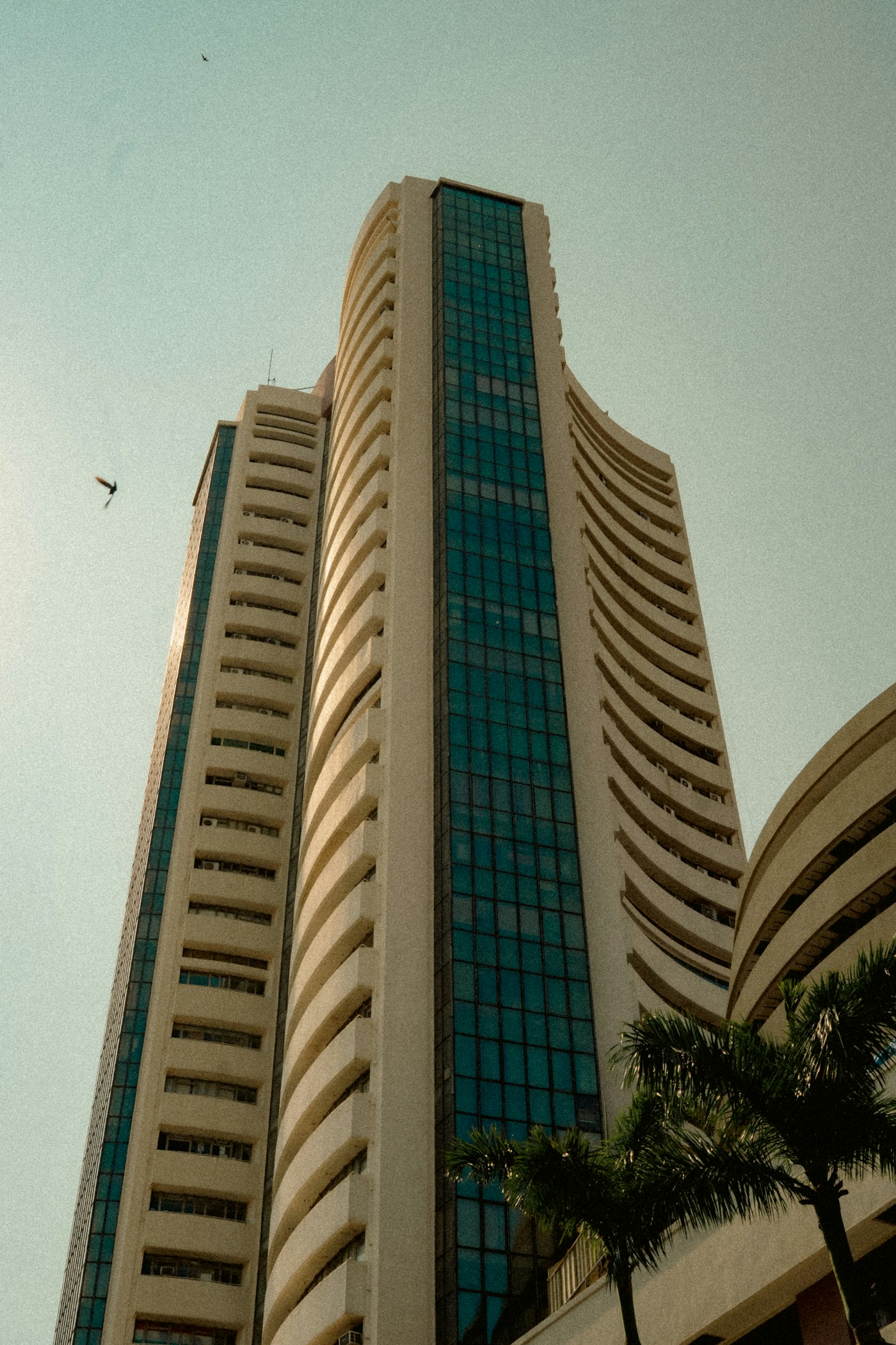 The BSE tower on Dalal Street, Mumbai, rising into a clear sky