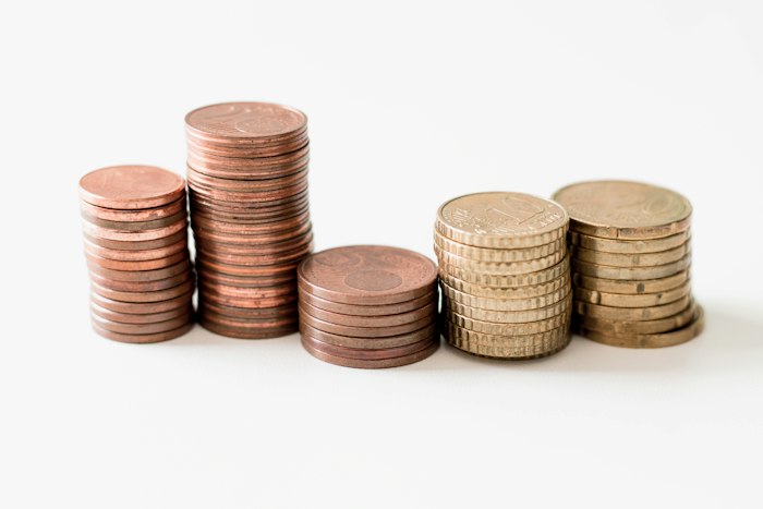 Stacks of copper and gold-coloured coins