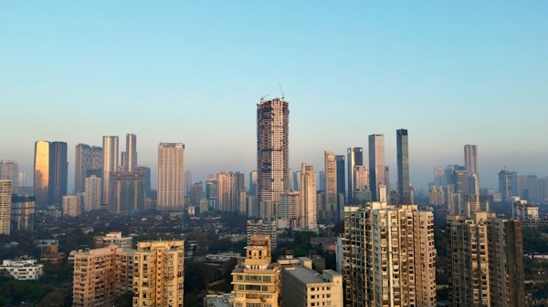 The Mumbai skyline of tall towers under a clear blue sky